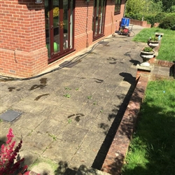 Before we pressure washed a patio area, Copdcok near Ipswich